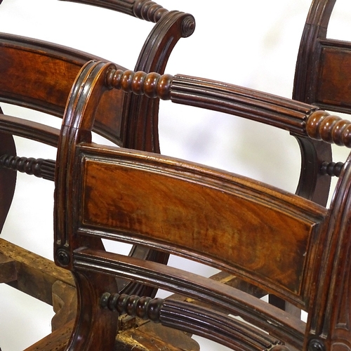 433 - A set of 6 George III Irish mahogany dining chairs, with carved and fluted back rails, and sabre leg... 