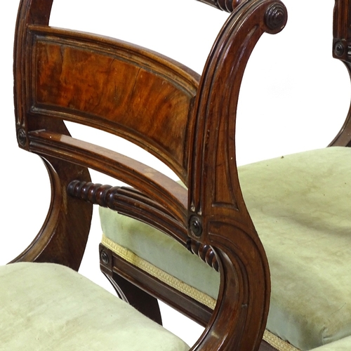 433 - A set of 6 George III Irish mahogany dining chairs, with carved and fluted back rails, and sabre leg... 