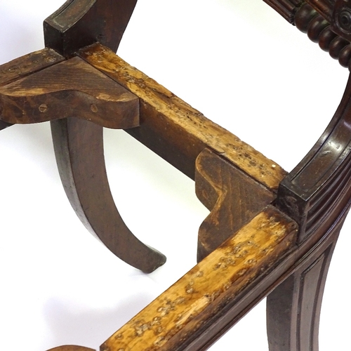 433 - A set of 6 George III Irish mahogany dining chairs, with carved and fluted back rails, and sabre leg... 