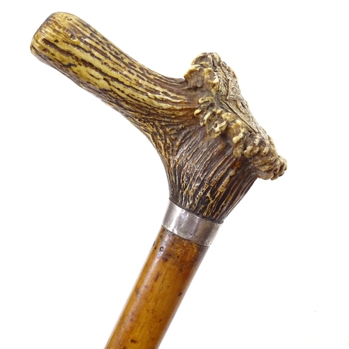 127 - A Malacca walking stick with stag horn handle and carved double-headed eagle Masonic emblem