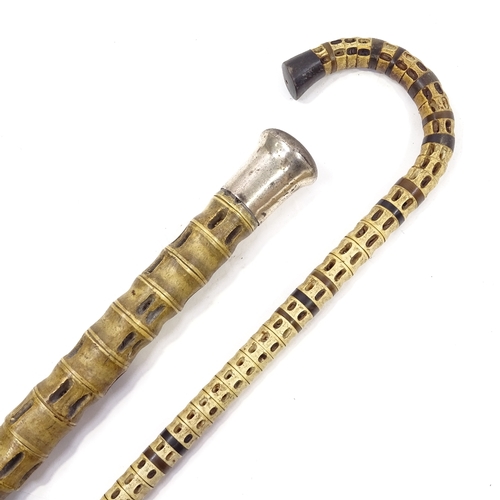 128 - A thick shark vertebrae walking stick with nickel plate handle, and another shark vertebrae walking ... 