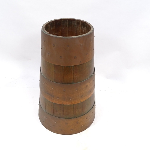 129 - A stained wood and copper-banded stick stand of tapered form, height 54cm, rim diameter 23cm