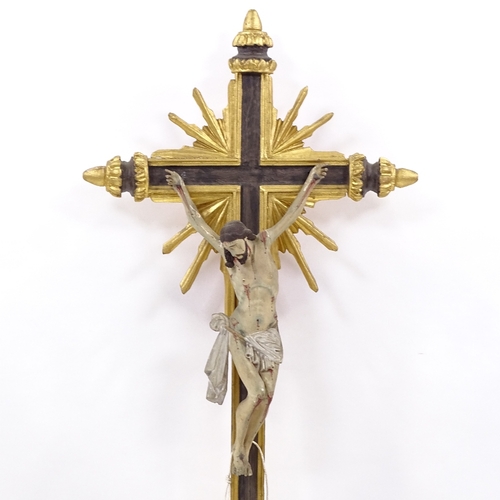 132 - A 19th century carved painted and gilded wood crucifix, height 94cm