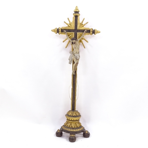 132 - A 19th century carved painted and gilded wood crucifix, height 94cm