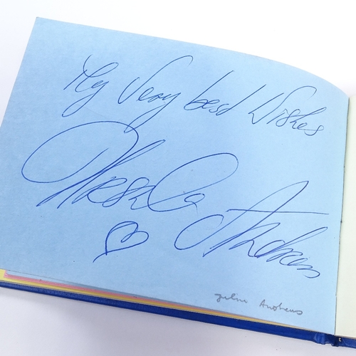 136 - An autograph book, including original signatures by Muhammad Ali, Gene Kelly, Charlton Heston, Barba... 