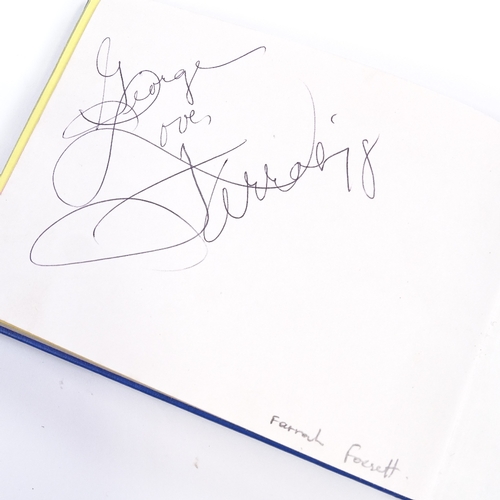 136 - An autograph book, including original signatures by Muhammad Ali, Gene Kelly, Charlton Heston, Barba... 