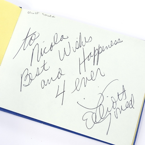 136 - An autograph book, including original signatures by Muhammad Ali, Gene Kelly, Charlton Heston, Barba... 