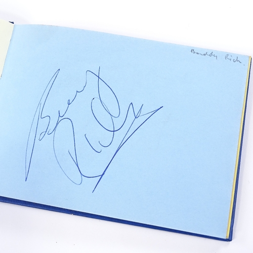 136 - An autograph book, including original signatures by Muhammad Ali, Gene Kelly, Charlton Heston, Barba... 