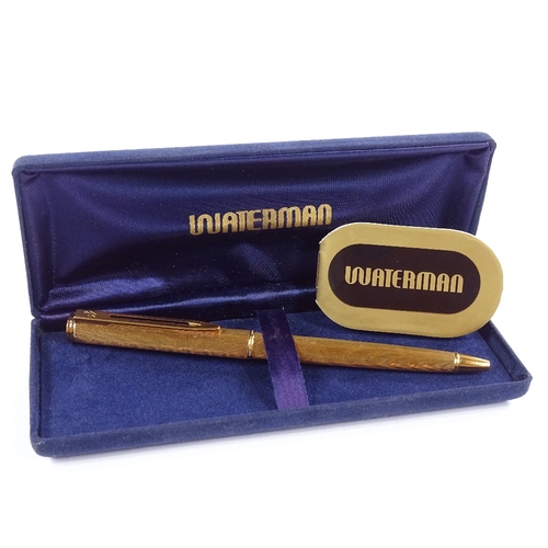 137 - A Waterman Moire pattern gold plated ballpoint pen, boxed