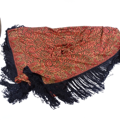 138 - A Chinese hand embroidered red ground floral design silk scarf with black fringe, panel size 136cm x... 