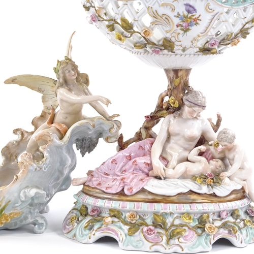 140 - A French porcelain table centre basket supported by Classical figures, circa 1900, height 28cm, and ... 