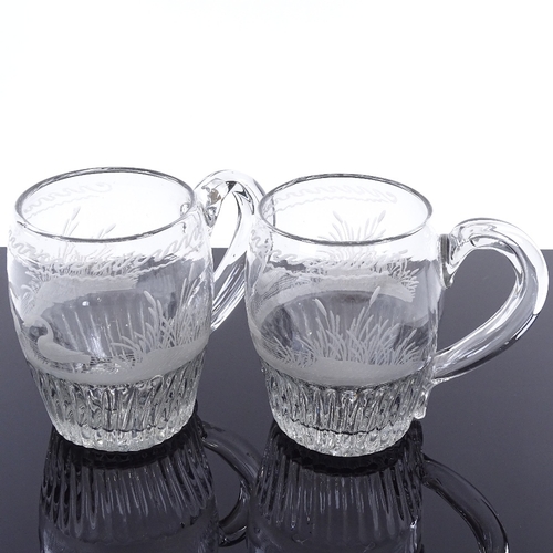 142 - A pair of 18th century glass barrel-shaped tankards, with wheel engraved swan designs, height 11cm