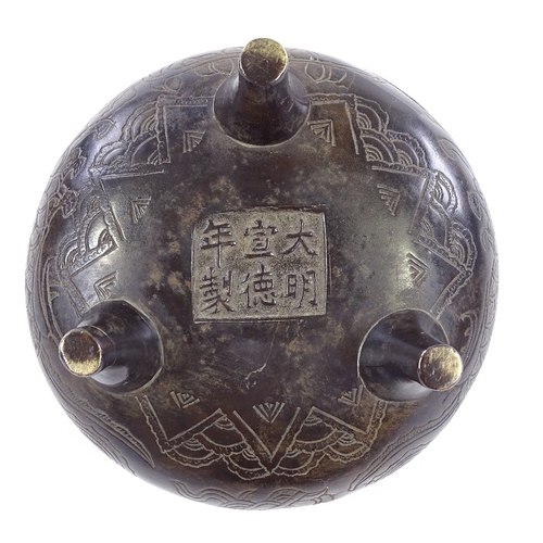 146 - A Chinese patinated bronze 2-handled Ding incense burner, with incised decoration and 6 character se... 