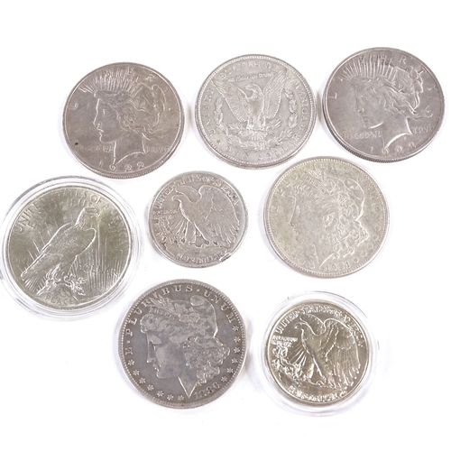 165 - A collection of 19th and 20th century American silver dollars and half dollar coins