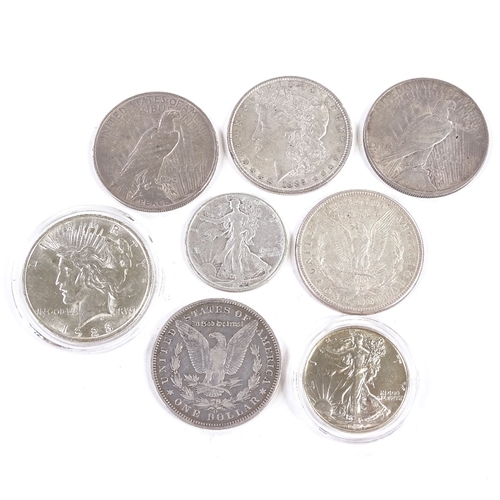 165 - A collection of 19th and 20th century American silver dollars and half dollar coins