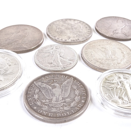 165 - A collection of 19th and 20th century American silver dollars and half dollar coins