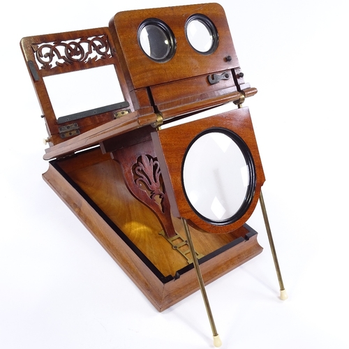 187 - A Victorian mahogany table-top stereoscopic card viewer, with pierced fretwork panel and ivory knobs... 