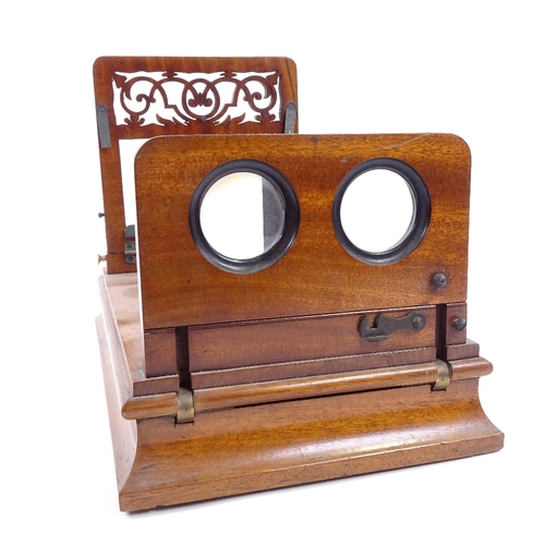 187 - A Victorian mahogany table-top stereoscopic card viewer, with pierced fretwork panel and ivory knobs... 