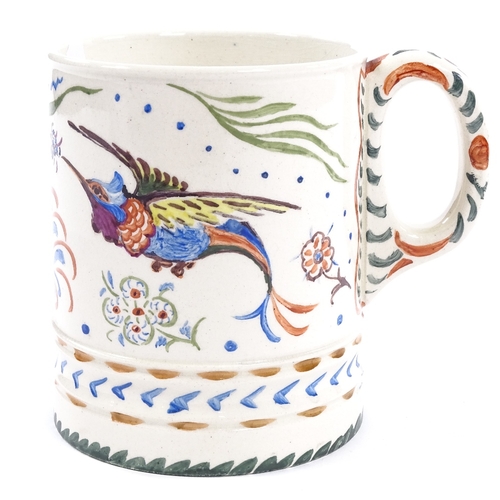 191 - A Moorcroft Pottery pint mug with hand painted exotic birds and flowers, impressed Moorcroft marks w... 