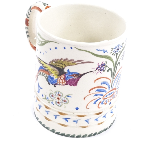 191 - A Moorcroft Pottery pint mug with hand painted exotic birds and flowers, impressed Moorcroft marks w... 