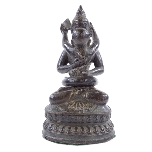 393 - An Indian bronze figure of Buddha holding a child, height 17cm