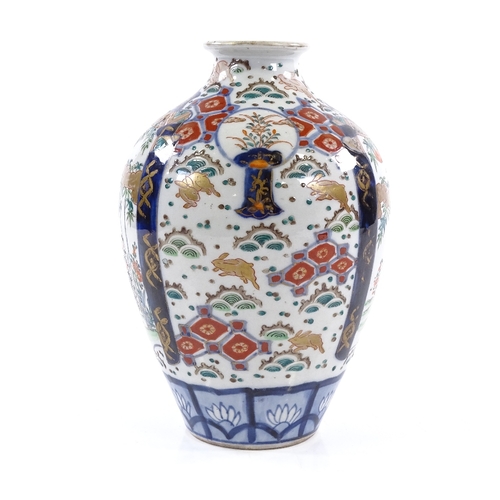 396 - A Chinese famille rose porcelain vase, hand painted enamel decoration and gilded hares, height 21cm