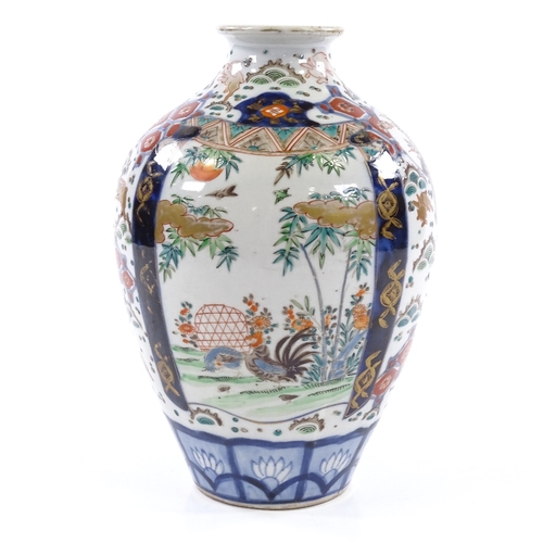 396 - A Chinese famille rose porcelain vase, hand painted enamel decoration and gilded hares, height 21cm