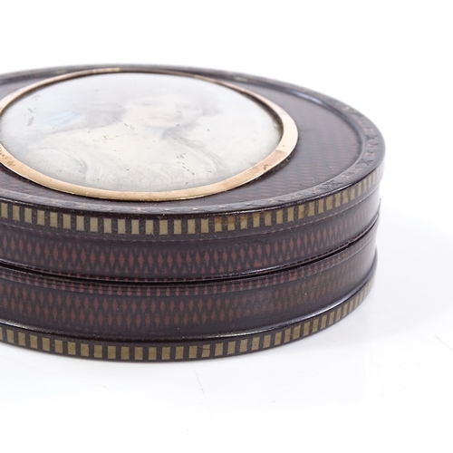 402 - A fine early 19th century circular lacquer box with painted crosshatch design, the lid having an ins... 