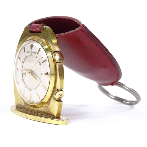 454 - JAEGER LECOULTRE - a gold plated travelling keyring timepiece/clock, silvered dial with gilt baton h... 