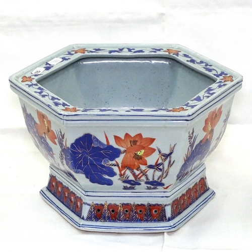 528 - An Imari jardiniere of hexagonal form, 27cm across