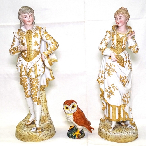 530 - A pair of French porcelain figures with gilded decoration, 39cm, and a Beswick barn owl