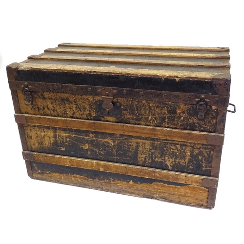 404 - Early Louis Vuitton wood and metal-bound travelling trunk, original label inside, serial no. 141019,... 