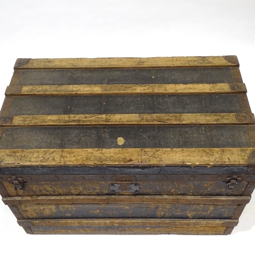 404 - Early Louis Vuitton wood and metal-bound travelling trunk, original label inside, serial no. 141019,... 