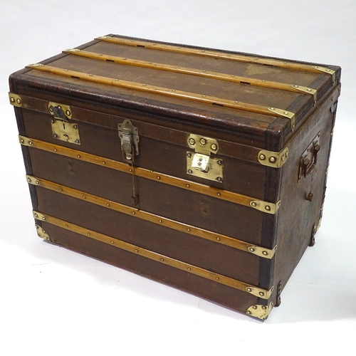 405 - An early wood leather and brass-bound travelling trunk by Moynat, original label inside lid, 90cm x ... 