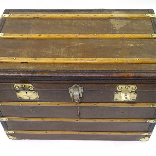 405 - An early wood leather and brass-bound travelling trunk by Moynat, original label inside lid, 90cm x ... 