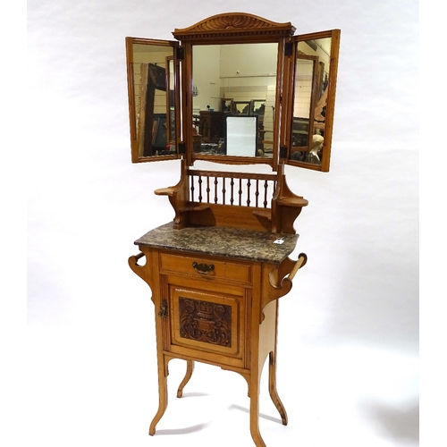 413 - An Arts and Crafts light oak marble-topped wash stand, with mirror inset upper part