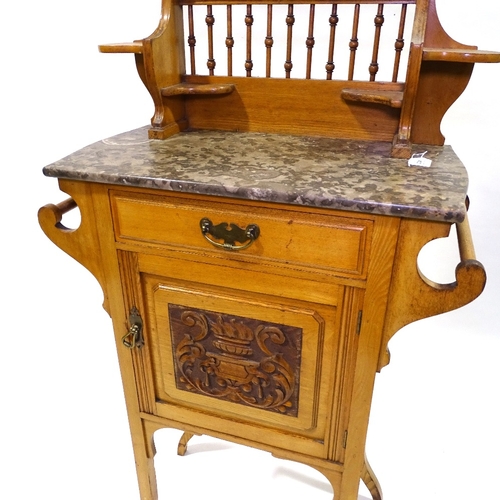 413 - An Arts and Crafts light oak marble-topped wash stand, with mirror inset upper part