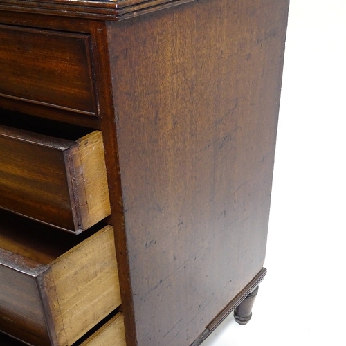 417 - A George III mahogany bow-front chest of drawers, original bras handles and turned feet, width 104cm