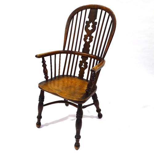 422 - A 19th century bow-arm Windsor chair with crinoline stretcher