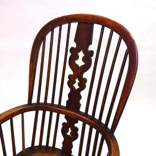 422 - A 19th century bow-arm Windsor chair with crinoline stretcher