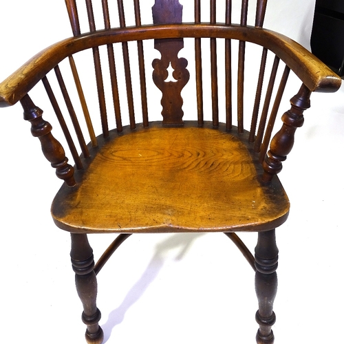 422 - A 19th century bow-arm Windsor chair with crinoline stretcher