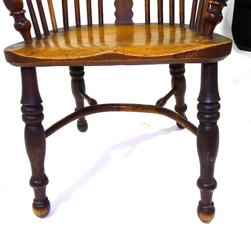 422 - A 19th century bow-arm Windsor chair with crinoline stretcher