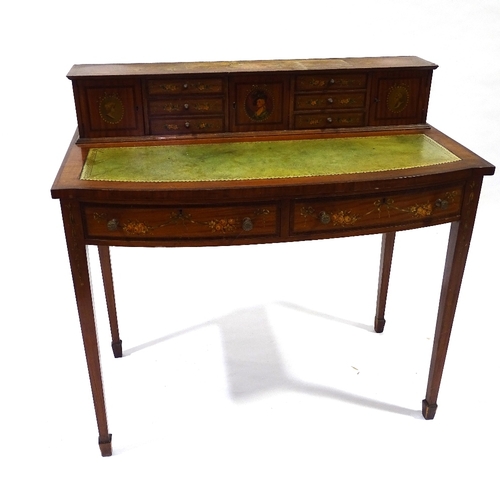 423 - An Edwardian satinwood and rosewood crossbanded writing desk, with painted decoration, width 94cm