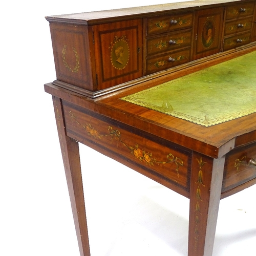 423 - An Edwardian satinwood and rosewood crossbanded writing desk, with painted decoration, width 94cm