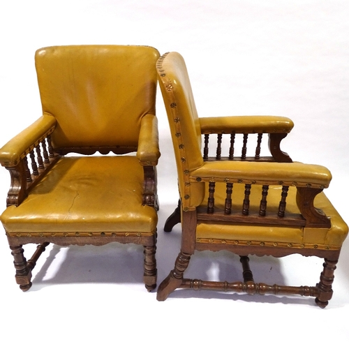 428 - A pair of Victorian oak-framed leather upholstered armchairs