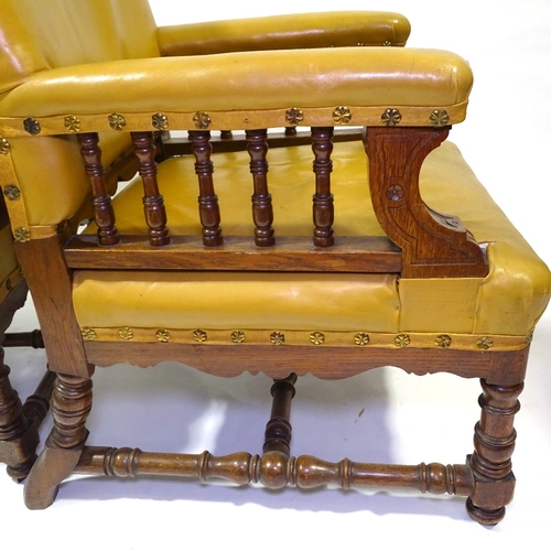 428 - A pair of Victorian oak-framed leather upholstered armchairs