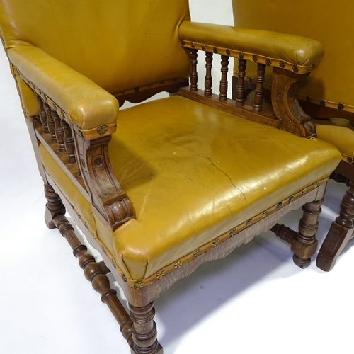 428 - A pair of Victorian oak-framed leather upholstered armchairs