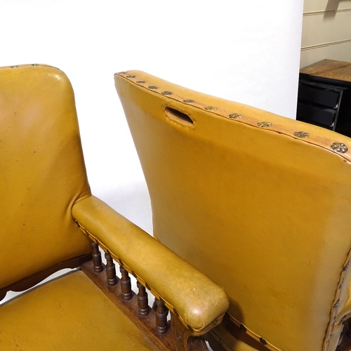 428 - A pair of Victorian oak-framed leather upholstered armchairs