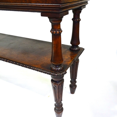 429 - A 19th century amboyna 2-tier buffet with carved supports, width 137cm