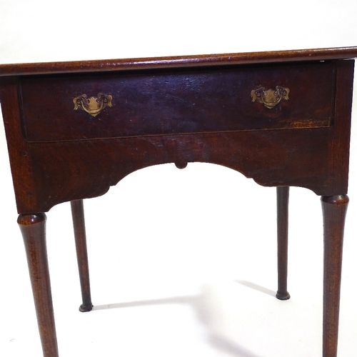 432 - An 18th century oak lowboy, with frieze drawer, turned legs and pad feet, width 79cm